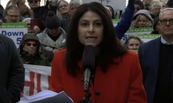 Attorney General Dana Nessel speaking into microphone