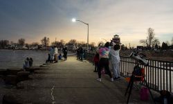 A crowd of solar eclipse enthusiasts at Luna Pier