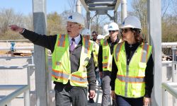 Gov. Gretchen Whitmer in a hard hat and gree 