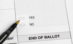 Election ballot with yes or no question and pen