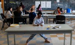 child doing schoolwork in a classroom