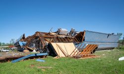 heavily damaged building after a tornado in Michigan