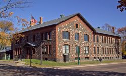 A brown, two-story building