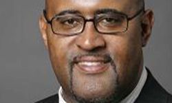 Ken Cockrel Jr. headshot. He is wearing a suit 