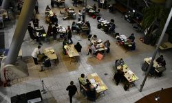 An aerial view of poll workers counting ballots at the end of Election Day at City Hall in Warren