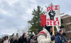 Someone holding a sign that says "DEI till I die" 