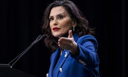 Gov. Gretchen Whitmer speaks into a microphone. 