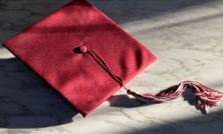A red graduation hat. 