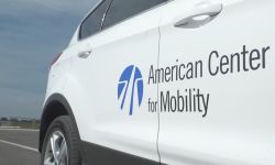 A white car with "American Center for Mobility." 