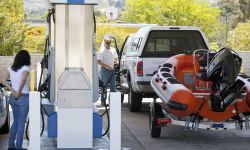 Two people in a gas station. 