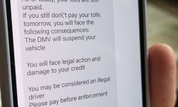 A scam text message is seen on a smartphone screen