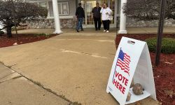 A sign that says "Vote Here."