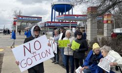 Marianne Pitts, center in white jacket, joined several hundred people in Big Rapids in 2023, lining both sides of South State Street to protest Gotion.