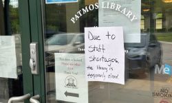 A sign stating the Patmos Public Library is closed due to a staff shortage.