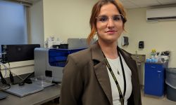 Penny Nowlin stands in a lab.