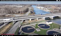 A screen grab of a YouTube video showing a bridge over a river