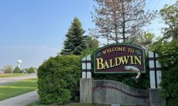 A sign welcomes travelers to Baldwin