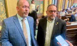 Rep. Mike Harris, R-Waterford Township, and Rep. Mike McFall, D-Hazel Park, speak to a reporter.