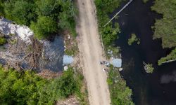 An aerial view of crews working on a culvert