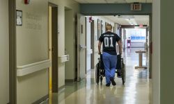 Someone pushes a wheelchair in Hillsdale Hospital in Michigan.