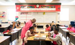 Teacher with her students in a classroom. 