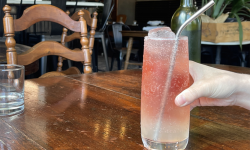 A pink mocktail on a table.