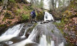 Steve Jurmu hiking a waterfall.