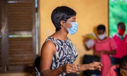 masked teacher in classroom