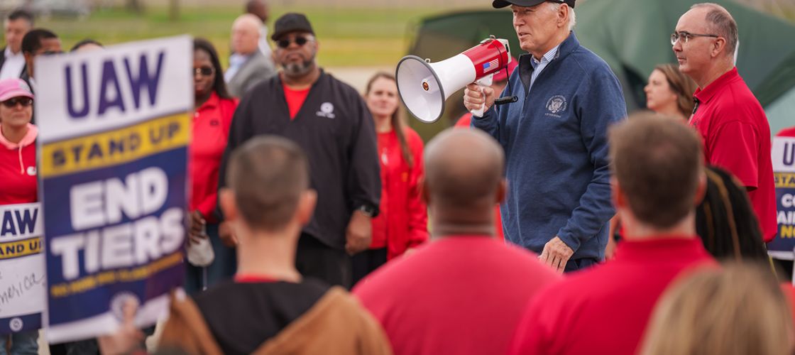 President Joe Biden speaks into a bullhorn