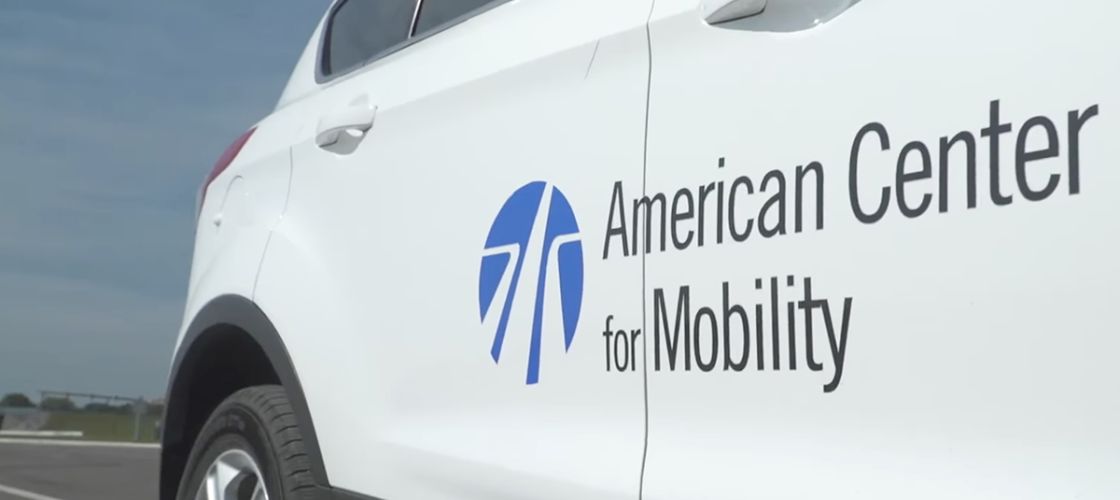 A white car with "American Center for Mobility." 
