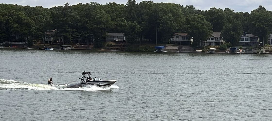 Wakeboarder goes across Brooks Lake in Michigan.